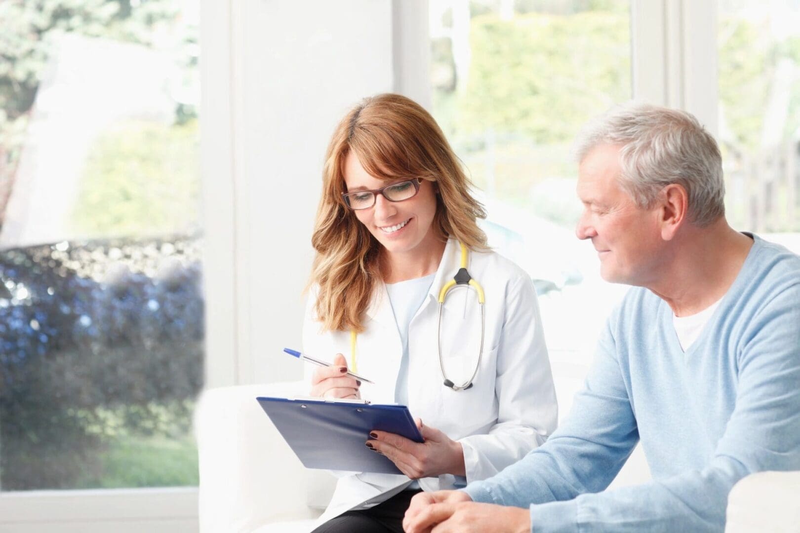 A doctor and patient are smiling at each other.